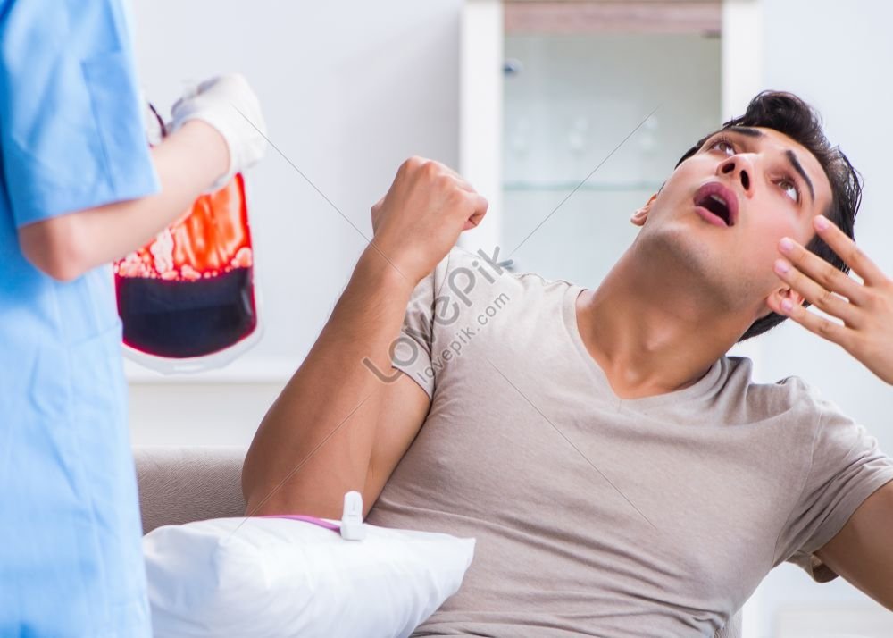 Photo Of A Patient Receiving A Blood Transfusion At A Hospital Clinic