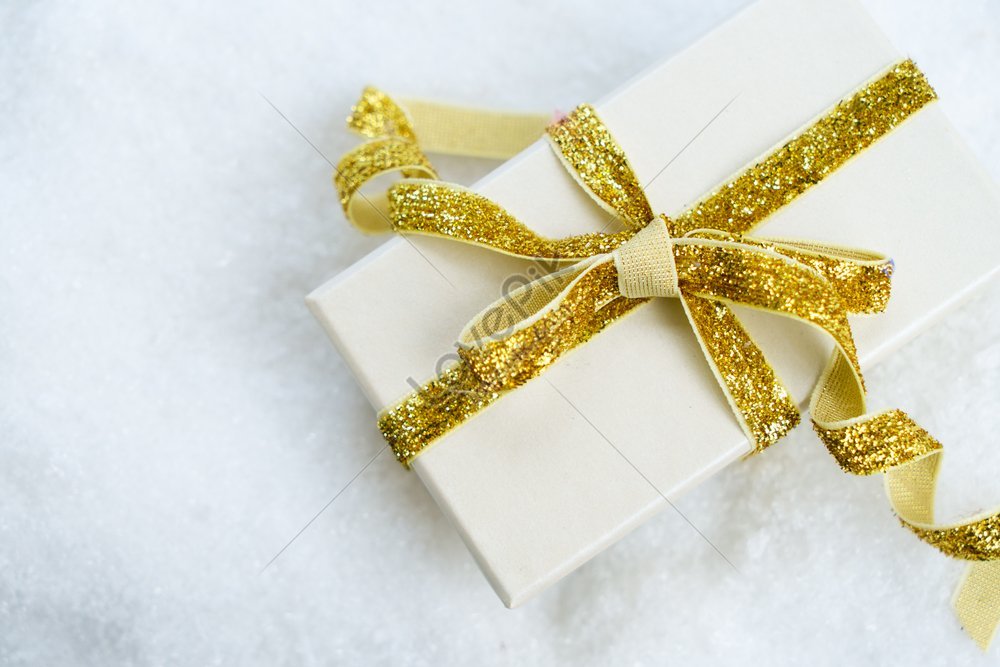 White Christmas Golden Gift Box With Ribbon In Snowy Scene Picture And