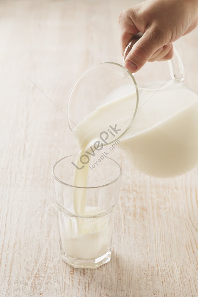 Milk Pouring Into A Glass From A Pitcher Picture Picture And Hd Photos