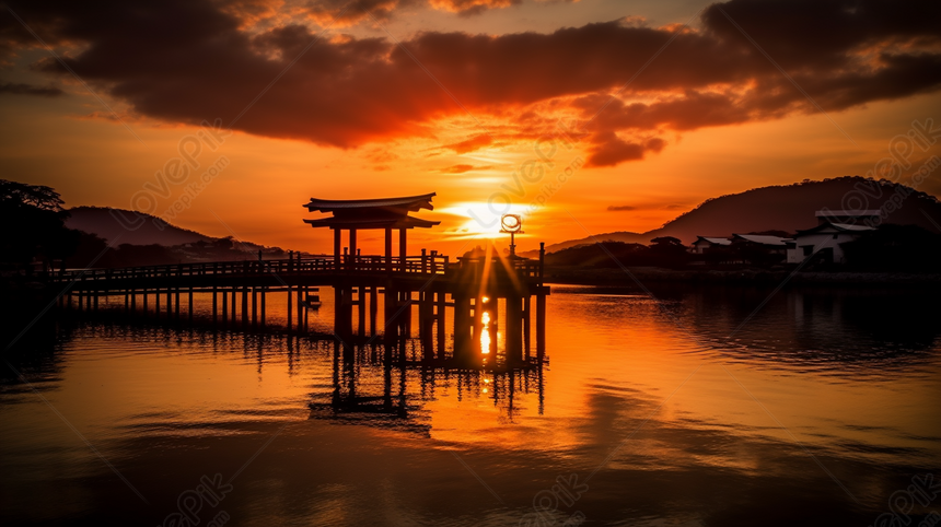 A Breathtaking Sunset Over A Japanese Building-lined Scenic Lake ...