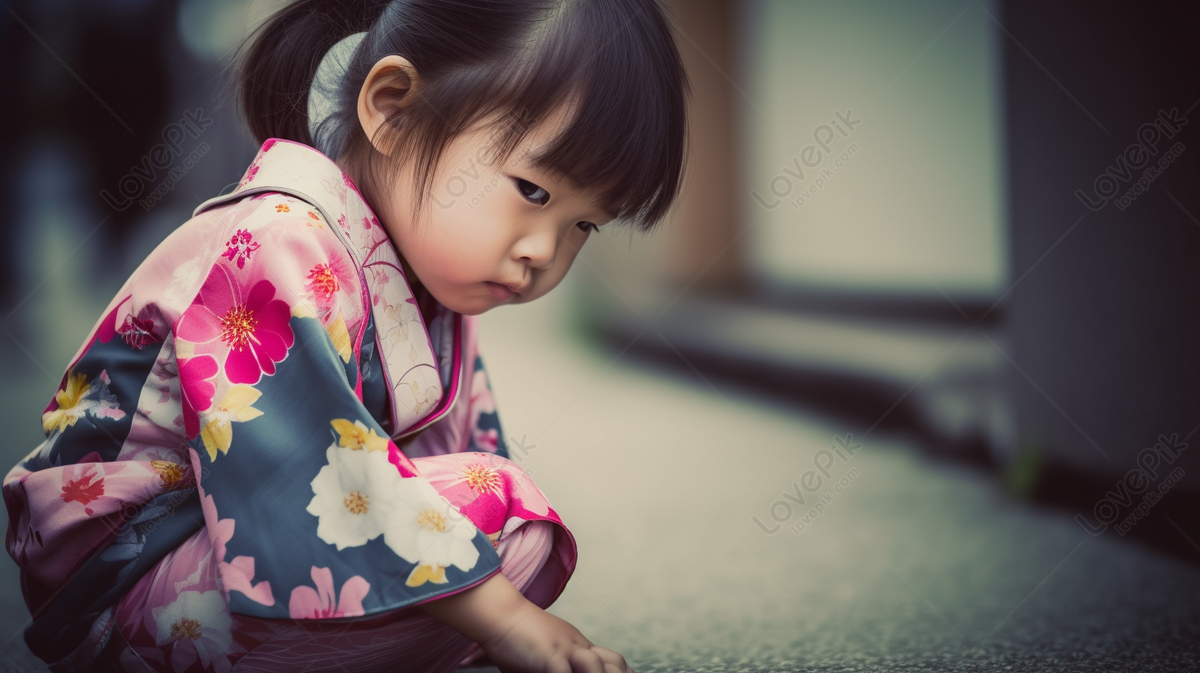 Little Girl In A Traditional Asian Outfit Is Crouching Down On The ...