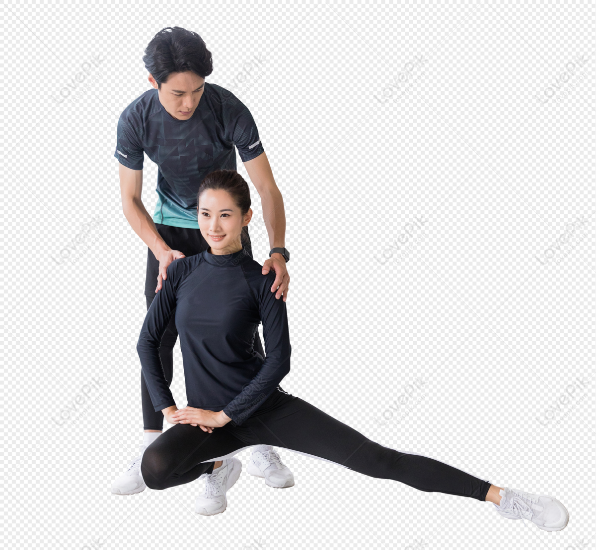 Fitness Instructor Guiding Young Woman When She Exercises.