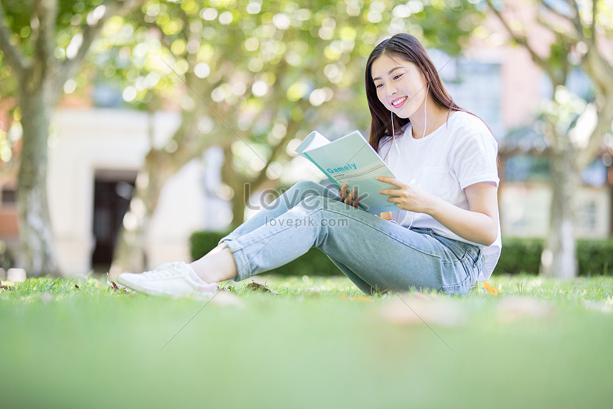 A Female Student Sitting On The Campus Lawn Reading Picture And HD ...