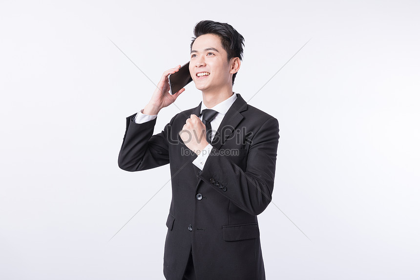 A Man Who Is Making A Phone Call To Do Business Picture And HD Photos ...