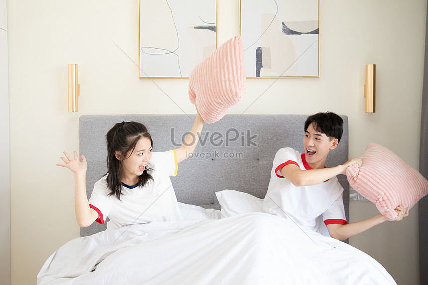couple playing in bed
