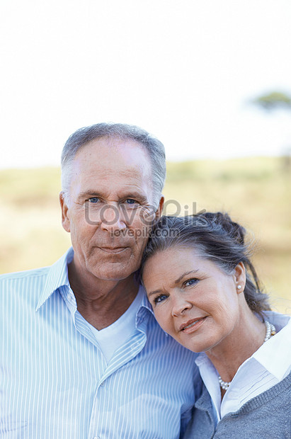 Affectionate, Happy Senior Couple poses for portrait Stock Photo - Alamy