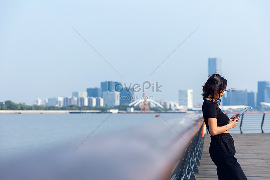 Outdoor Female Looking At Mobile Phone Picture And Hd Photos 