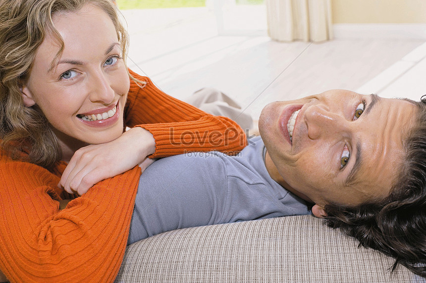 Young Couple Sitting On The Sofa Picture And Hd Photos Free Download On Lovepik 7269