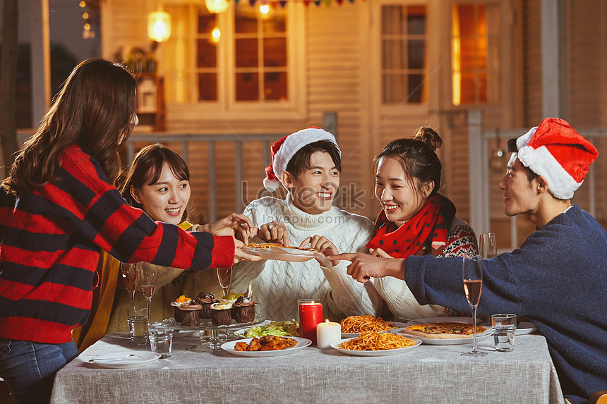 Young People Eating Pizza Together On Christmas Eve Picture And HD ...