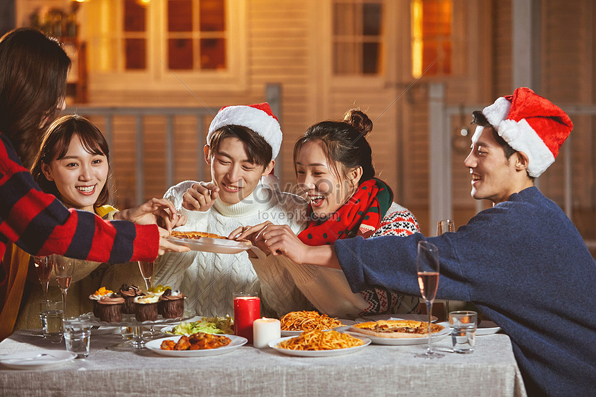 Young People Eating Pizza Together On Christmas Eve Picture And HD ...