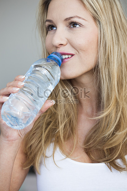 Young Woman Drinking A Bottle Of Water Picture And HD Photos | Free ...