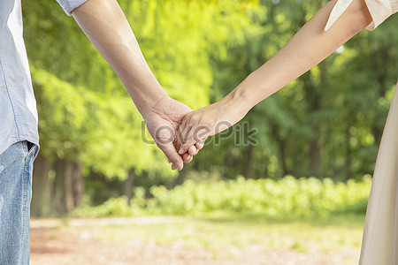 young couple holding hands