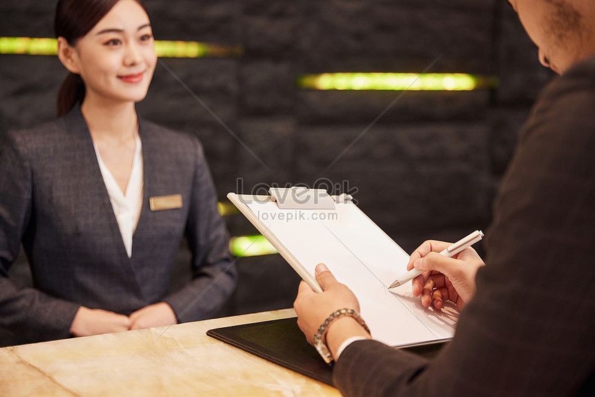 Hotel Front Desk Staff Check In For Customers Picture And HD Photos ...