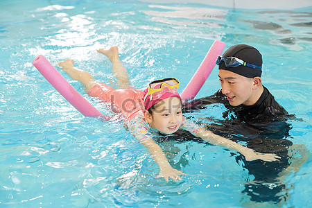 Little Girl Learning To Swim In Swimming Pool Picture And HD Photos