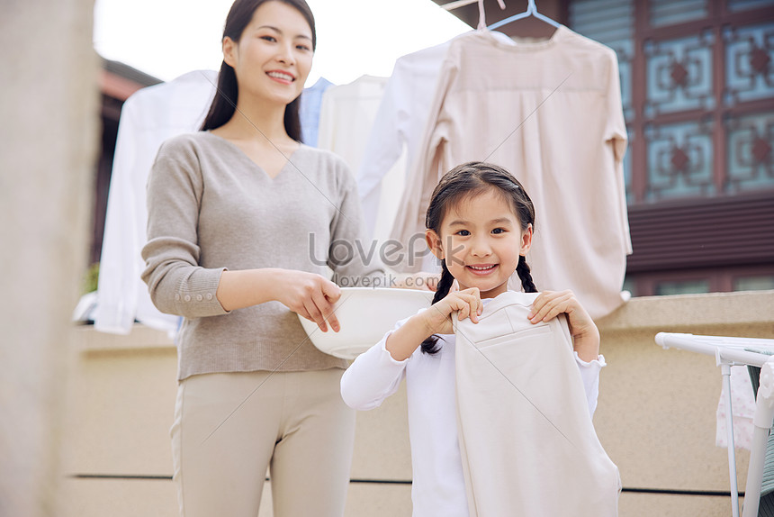 Daughter To Help Mother Dry Clothes Picture And HD Photos | Free ...