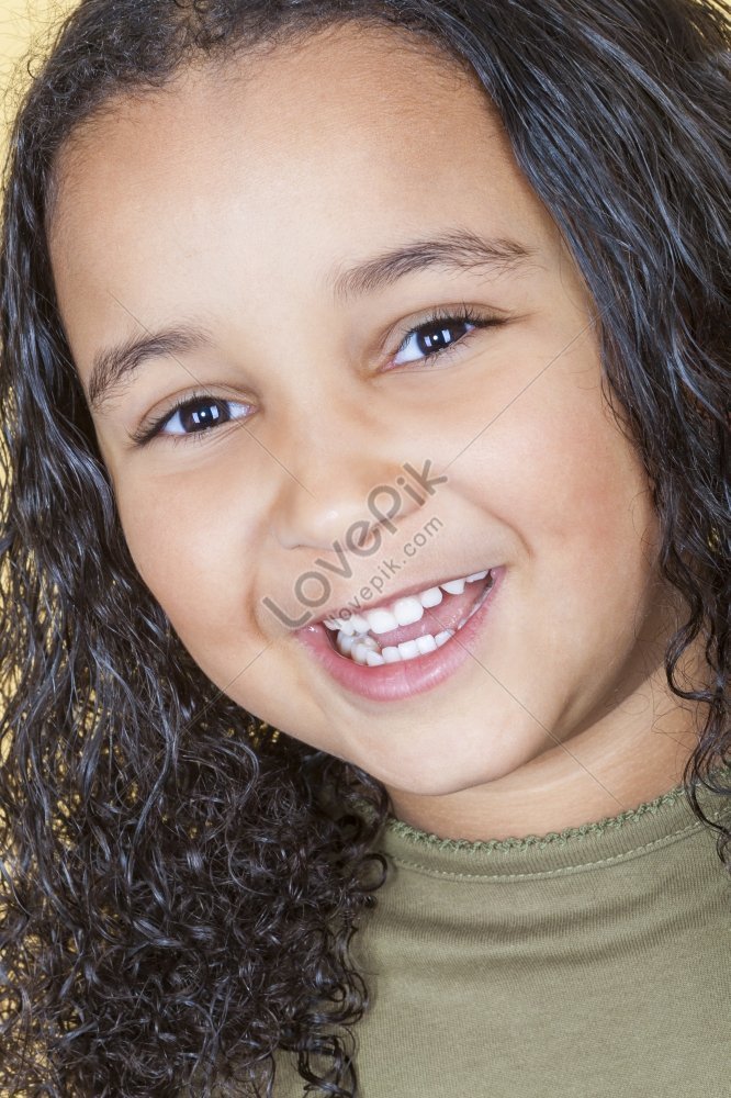 A Delighted Mixed Race African American Girl Laughing Joyfully Picture ...