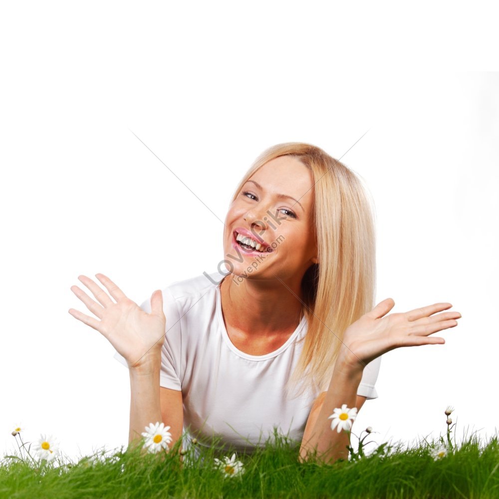 A Beautiful Young Blonde Woman Lying On Grass With Chamomile Flowers