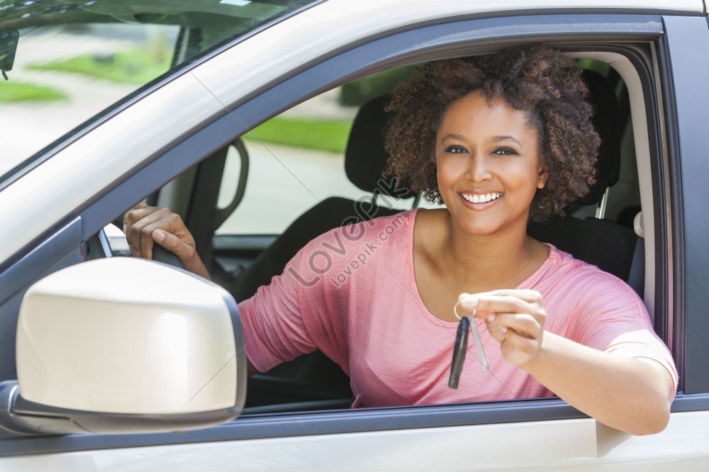 A Beautiful Young Mixed Race African American Woman Driving A Car And ...