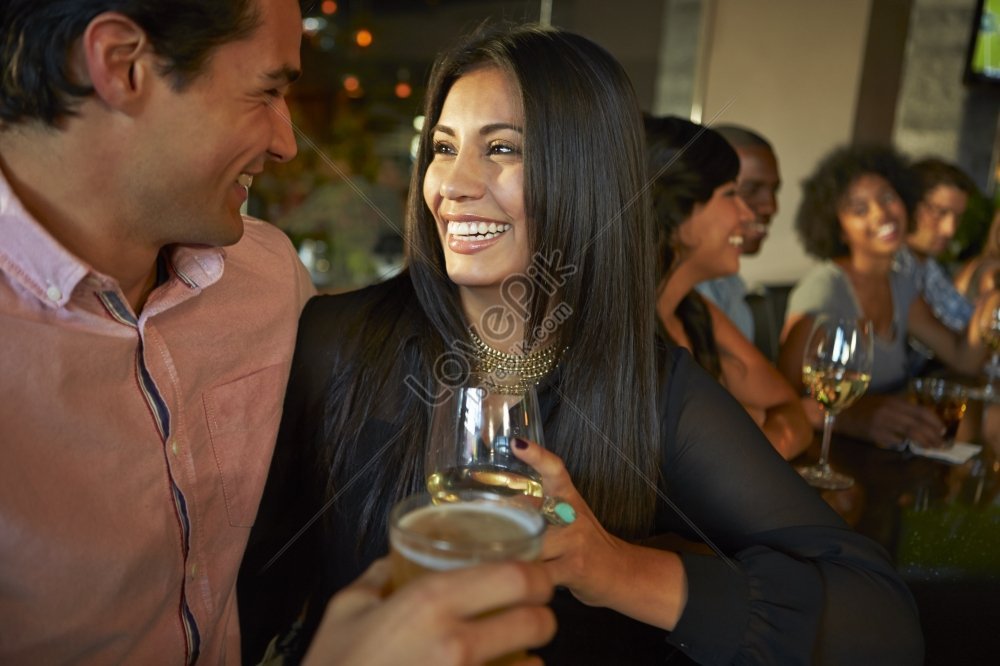 A Couple Enjoying Drinks With Friends At A Bar Picture And HD Photos ...