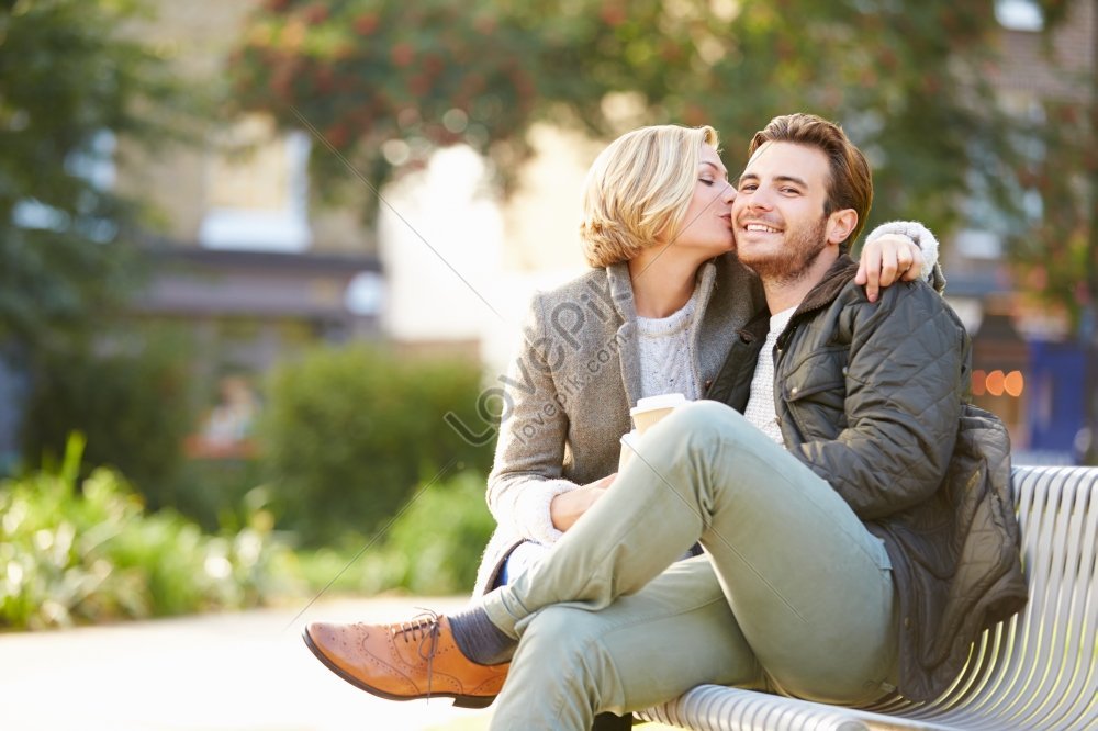 Couple Relaxing On Park Bench With Take Away Coffee Picture And HD ...