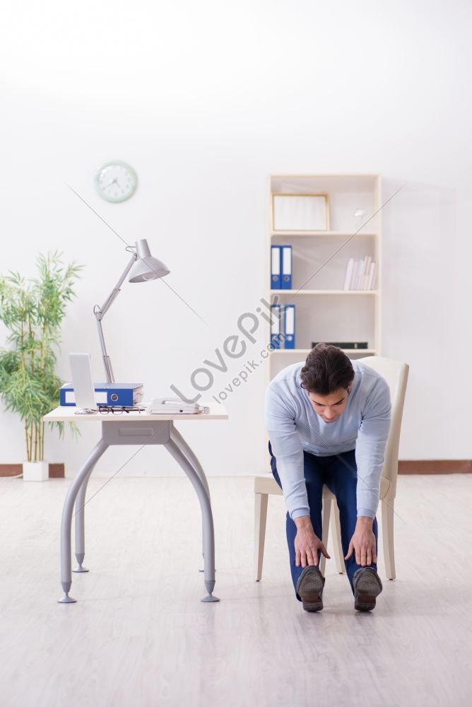 Employee Doing Stretching Exercises In The Office Photo Picture And HD ...
