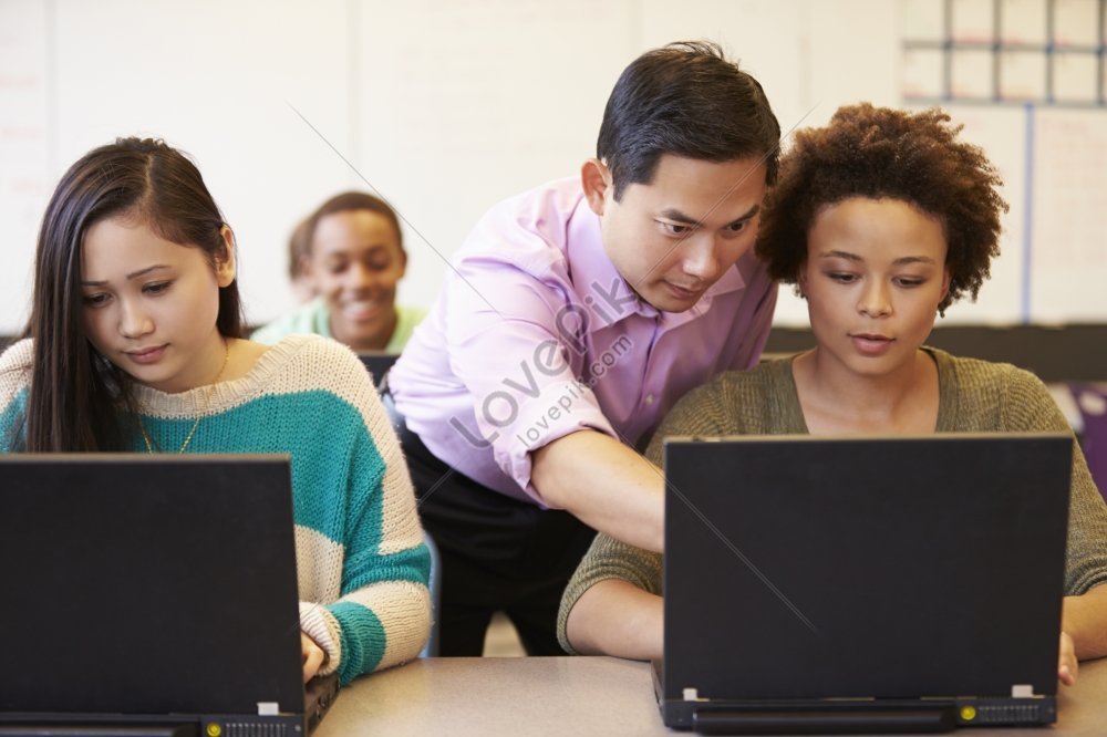 Technology is helping families stay in touch. Teacher with students. Elementary School students and teachers.