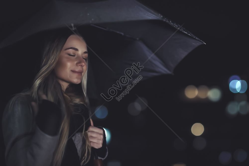 portrait of a pleasant and serene female with closed eyes and a smile outdoors at night, cold, ladies, close portrait HD Photo