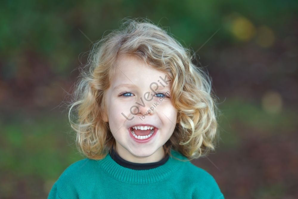 A Small Child With Long Blonde Hair Enjoying A Sunny Day Picture And HD