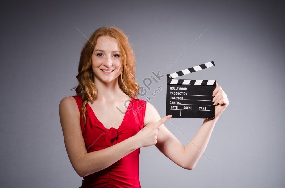 Woman In Red Dress Holding Movie Poster Picture And HD Photos | Free ...