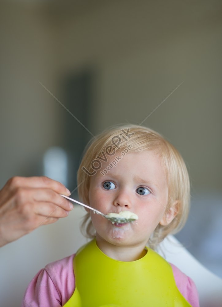 Mother Feeds Baby Food Picture And HD Photos