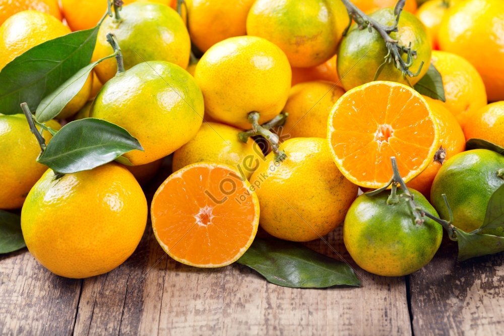 Fresh Mandarin Oranges Fruit With Leaves On Wooden Table. Stock Photo,  Picture and Royalty Free Image. Image 91454014.