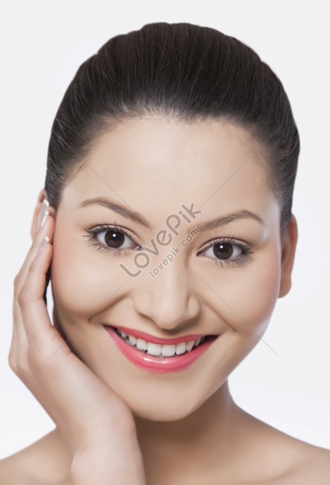 Portrait of woman touching grass Stock Photo - Alamy