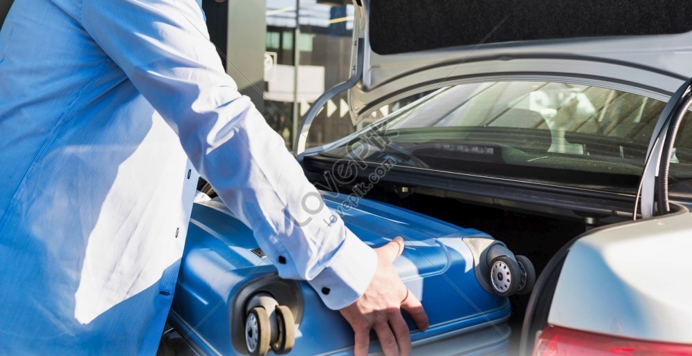 Portrait Of Mature Businessman Putting His Luggage On Car Trunk With ...