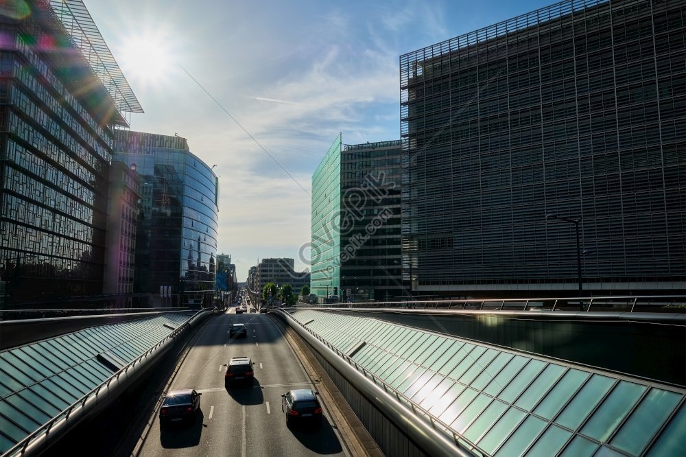 Sunset Photo Of Street Traffic Near European Commission Building On Rue ...