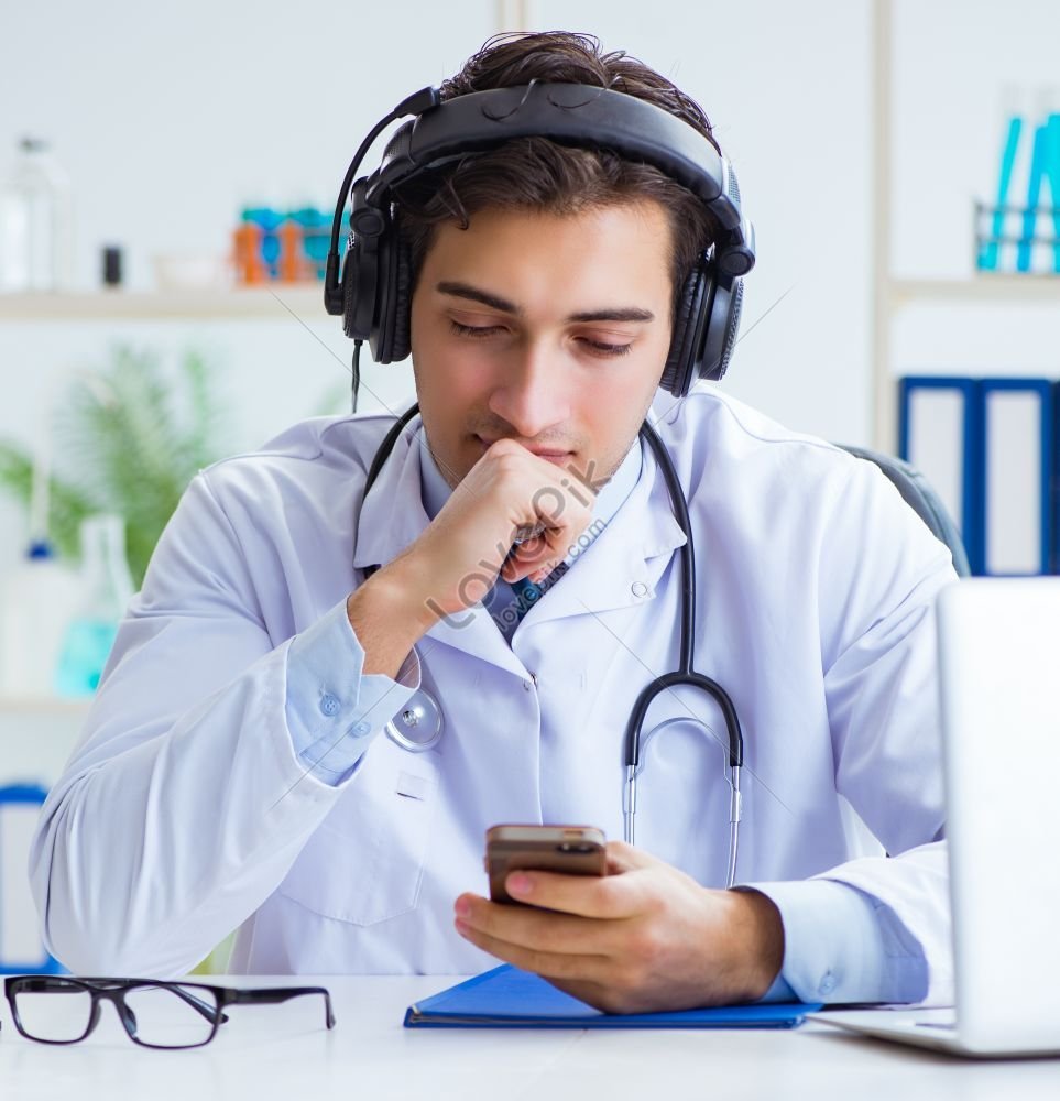 Male Doctor Listening To Patient During Telemedicine Session A Photo ...