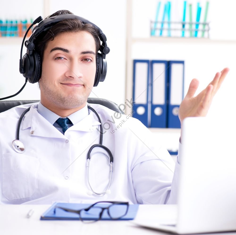 Male Doctor Listening To Patient During Telemedicine Session A Photo ...