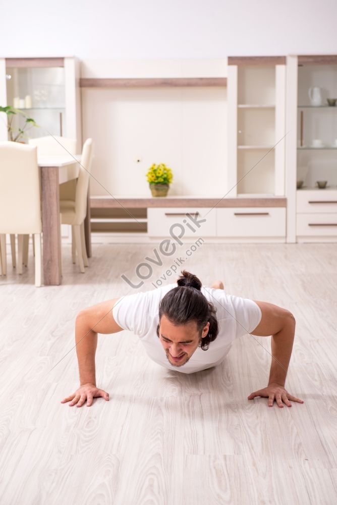 young man doing physical exercises at home photo, athletes, young, young exercise HD Photo