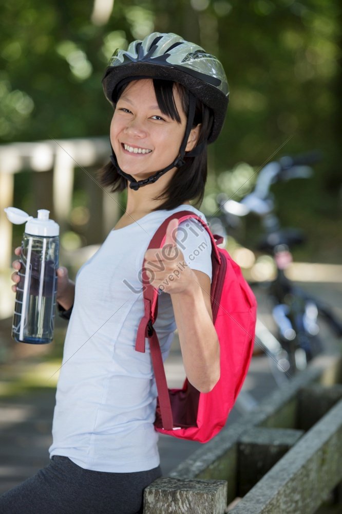 Woman Cyclist Giving A Thumb Up In An Outdoor Photo Picture And HD ...