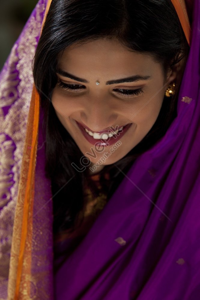 Portrait Of A Beautiful Smiling Indian Woman Wearing Saree And