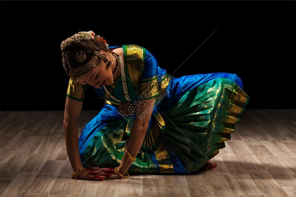 Beautiful woman in Bharatanatyam pose over white background Stock Photo -  Alamy