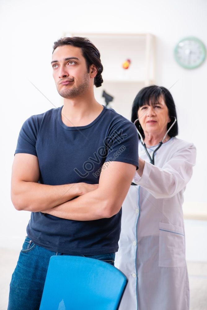 Photo Of Young Male Patient Visiting Aged Female Doctor Picture And HD ...