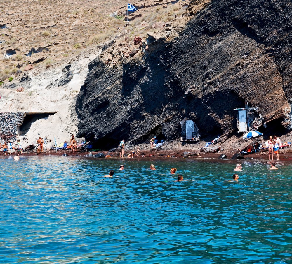 A Summertime Beach Photo Of The Hills And Rocks On The Greek Island Of ...