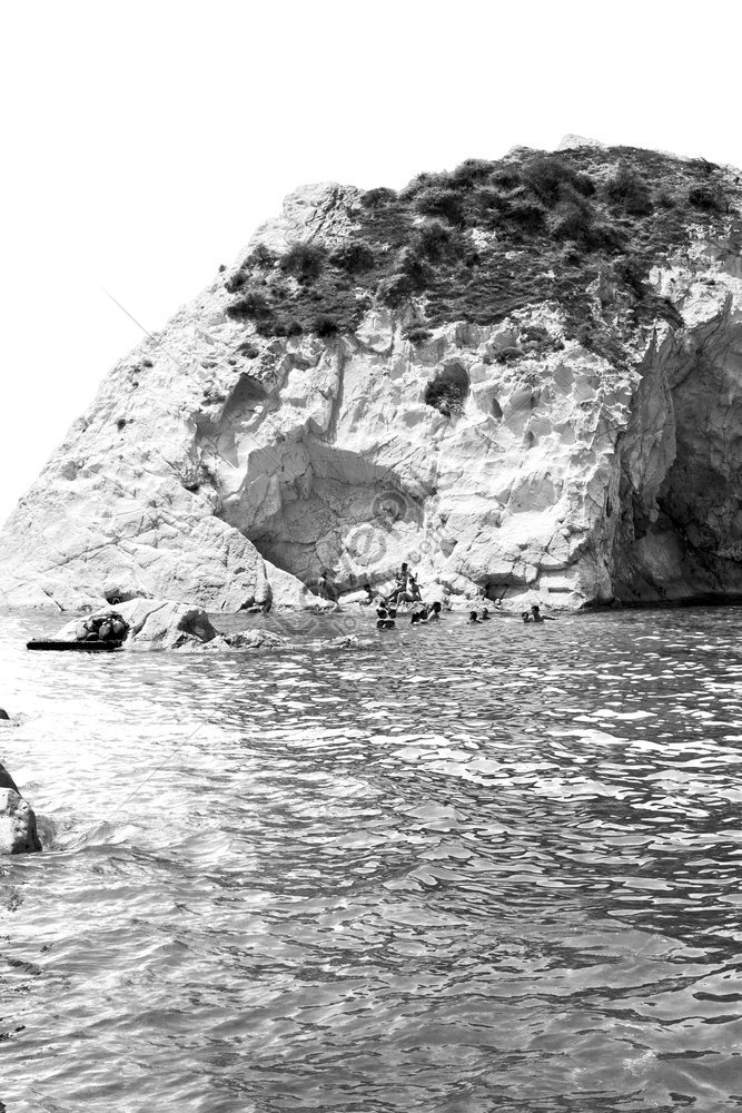 A Summertime Beach Photo Of The Hills And Rocks On The Greek Island Of ...