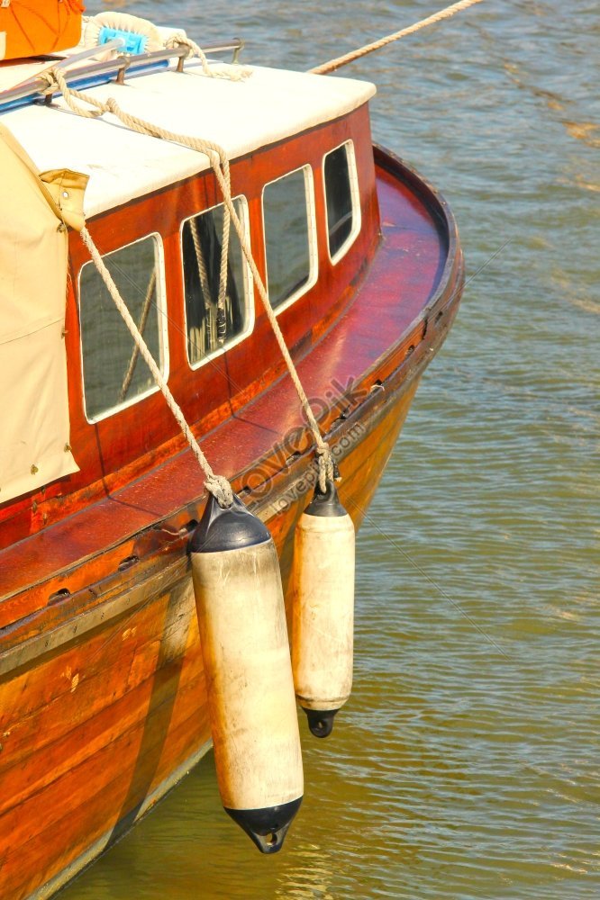 Side View Of A Wooden Vintage Boat In A Harbor Photo Picture And