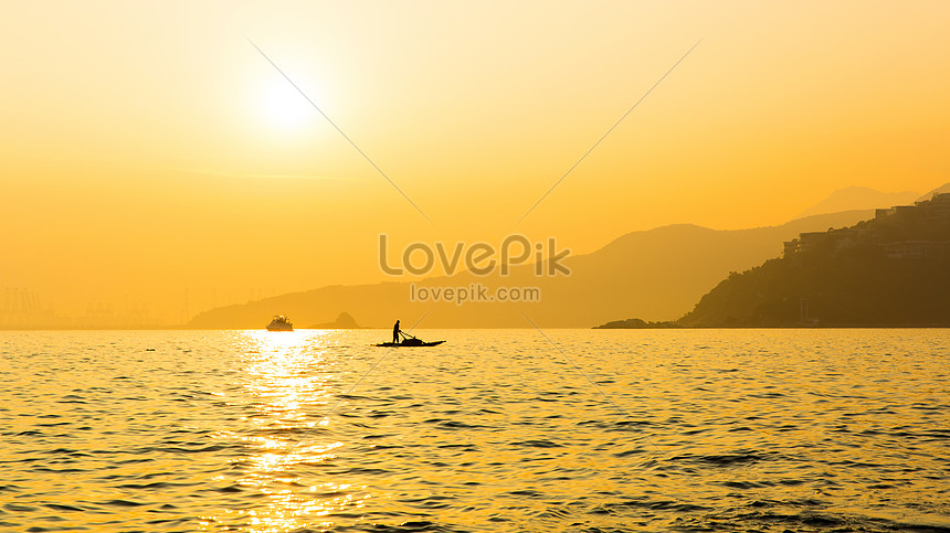 Photo De Coucher De Soleil Dans La Mer Avec La Silhouette De