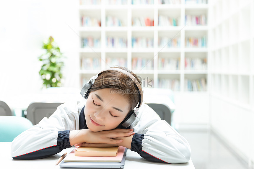 High School Students Desk Rest To Listen To Music Photo