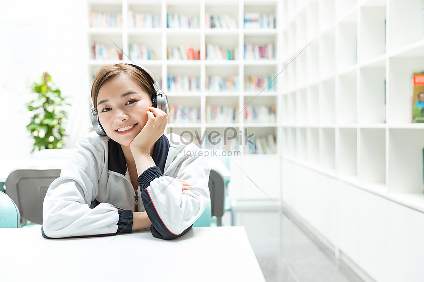 High School Students Desk Rest To Listen To Music Photo