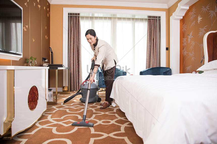 Cleaning and cleaning of hotel  room  vacuum cleaner  photo 