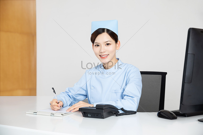 Nurse Working At The Hospital Front Desk Photo Image Picture Free