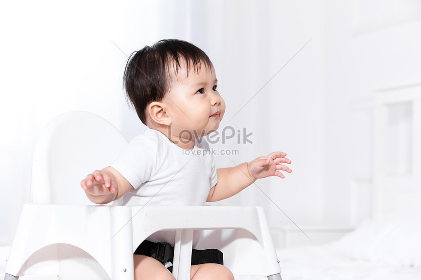 baby sitting in chair